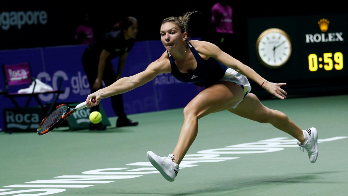 Simona Halep chases down a ball against Madison Keys