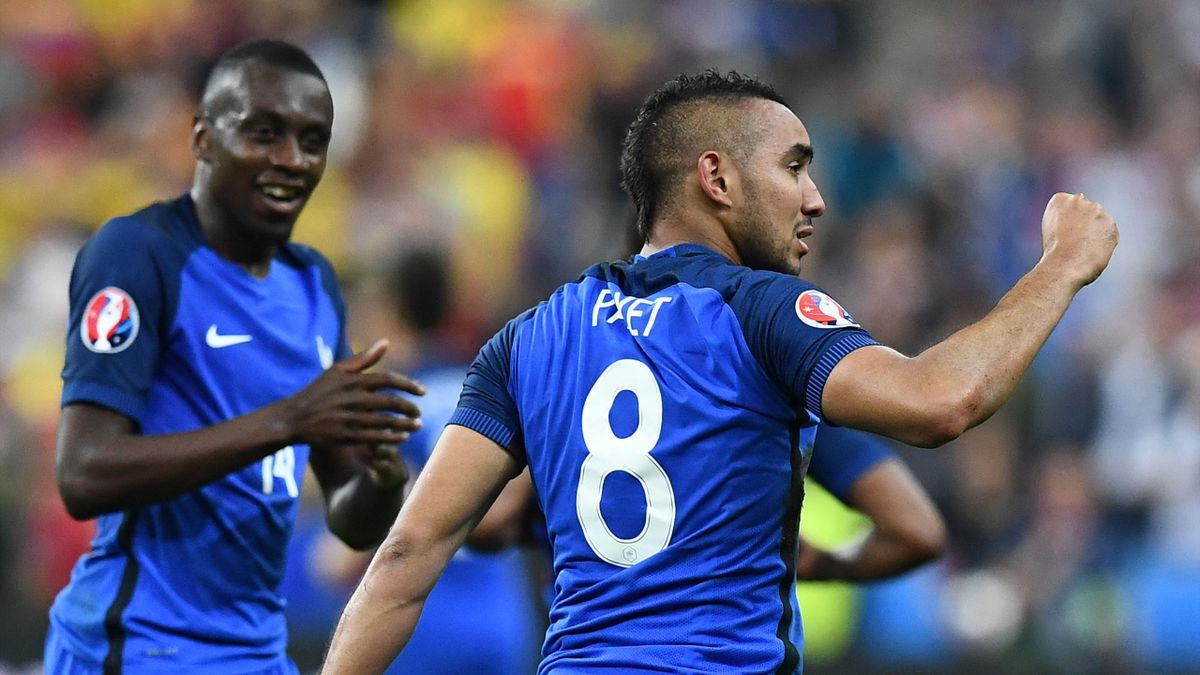 France's forward Dimitri Payet (R) celebrates after scoring the 2-1