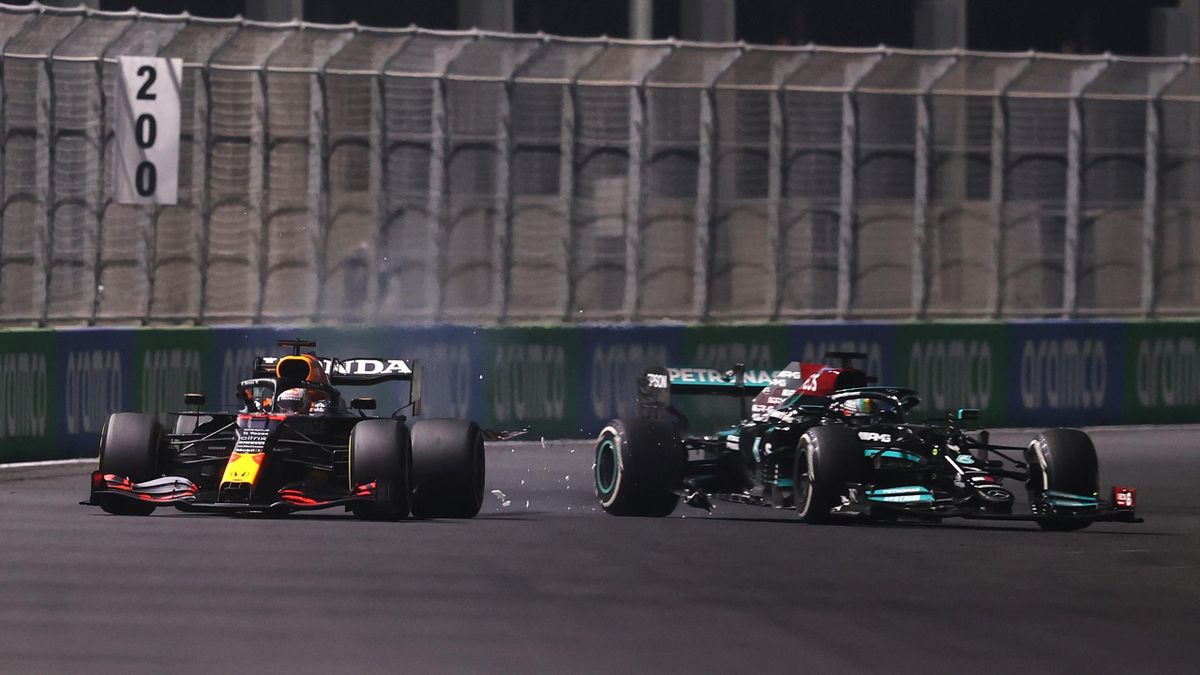Max Verstappen of the Netherlands driving the (33) Red Bull Racing RB16B Honda and Lewis Hamilton of Great Britain driving the (44) Mercedes AMG Petronas F1 Team Mercedes W12 collide during the F1 Grand Prix of Saudi Arabia at Jeddah Corniche Circuit on
