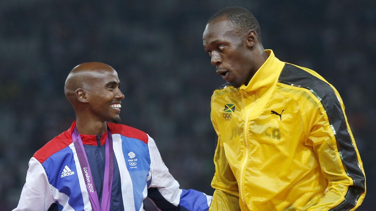 Jamaica's Usain Bolt (R) with Britain's Mo Farah on the podium at the London 2012 Olympics