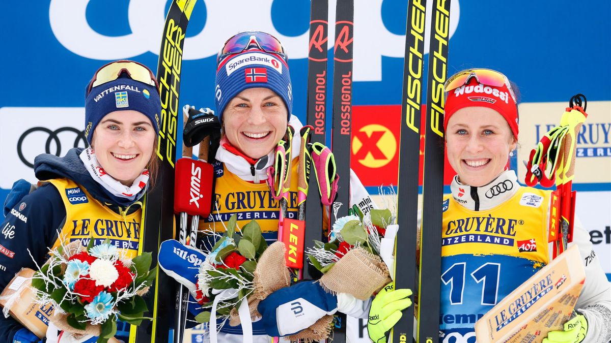 Astrid Uhrenholdt Jacobsen of Norway takes 1st place, Ebba Andersson takes 2nd place, Katharina Hennig of Germany takes 3rd place during the FIS Nordic World Cup Men's and Women's Cross Country Classic Mass Start on January 3, 2020 in Val Di Fiemme, Italy