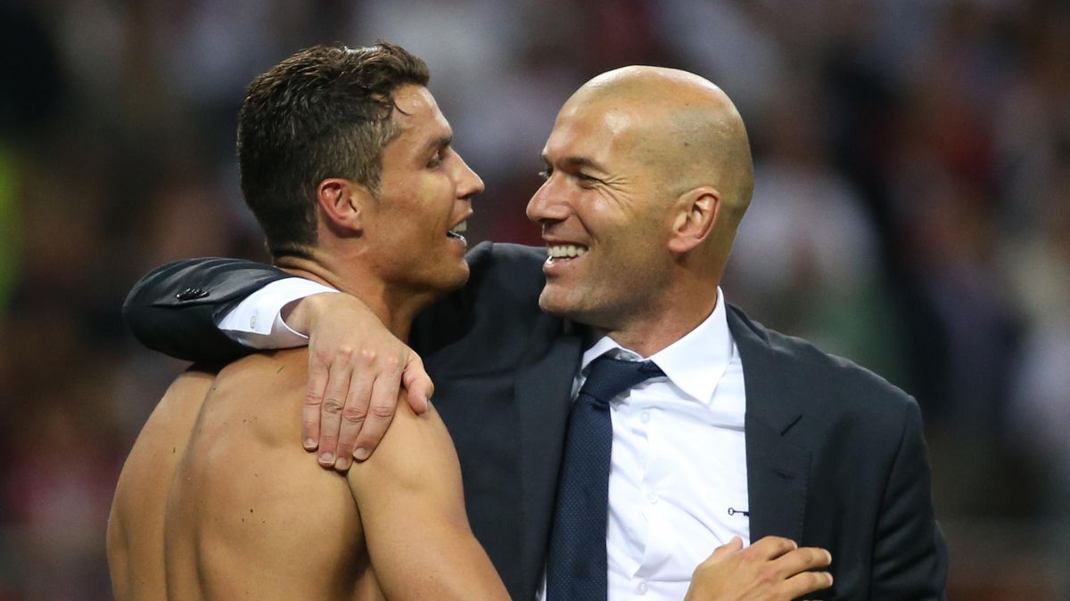 Real Madrid's Cristiano Ronaldo celebrates with coach Zinedine Zidane after winning the penalty shootout and the UEFA Champions League Final