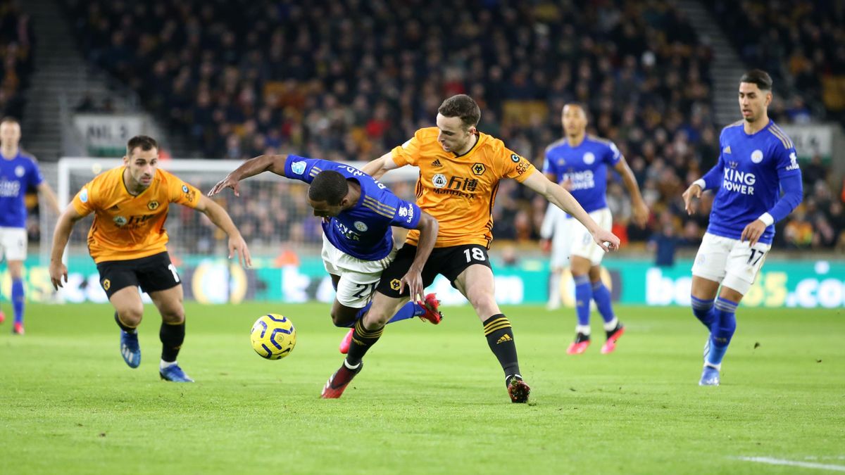 Ricardo Pereira of Leicester City in action with Diogo Jota of Wolverhampton Wanderers during the Premier League match at Molineux on February 14, 2020 in Wolverhampton, United Kingdom.