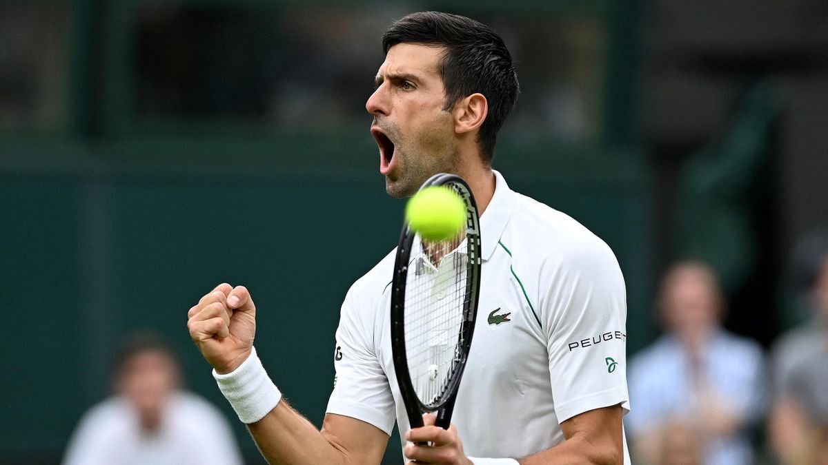 Serbia's Novak Djokovic celebrates going 2-1 up in the thrid set Britain's Jack Draper during their men's singles first round match on the first day of the 2021 Wimbledon Championships at The All England Tennis Club