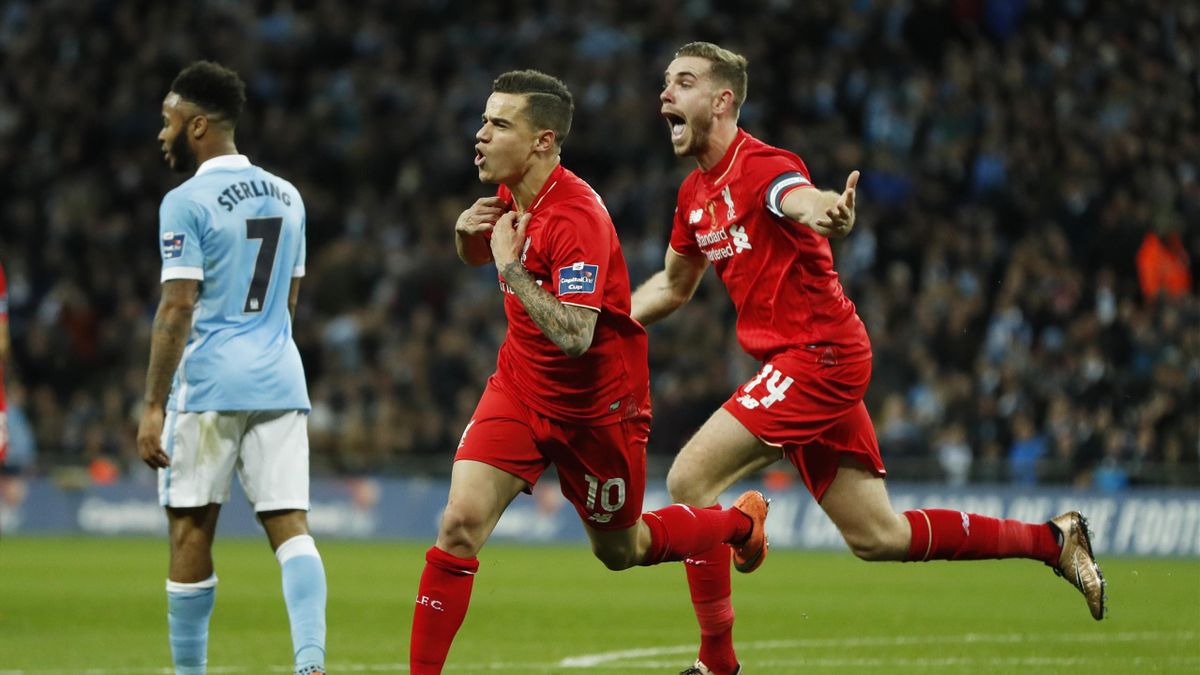 Liverpool's Philippe Coutinho celebrates scoring their first goal with Jordan Henderson