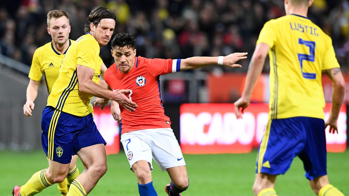 Chile's forward and team captain Alexis Sanchez (2ndR) vies with Sweden's midfielder Gustav Svensson (2ndL) during the international friendly football match Sweden vs Chile at the Friends Arena in Solna, Sweden on March 24, 2018, in preparation of the 201