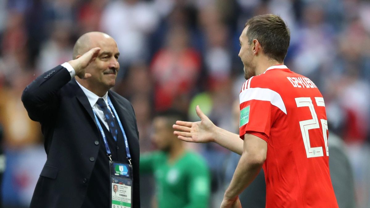 Russia coach Stanislav Cherchesov salutes Russia's Artem Dzyuba after he scored their third goal