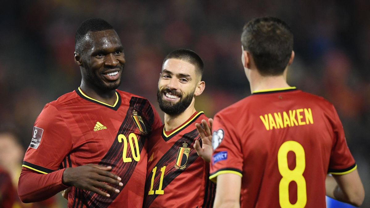 Belgium's forward Yannick Ferreira-Carrasco (C) celebrates with Belgium's forward Christian Benteke (L) after scoring a goal during the FIFA World Cup 2022 qualification football match between Belgium and Estonia at the Baudoin King Stadium in Brussels