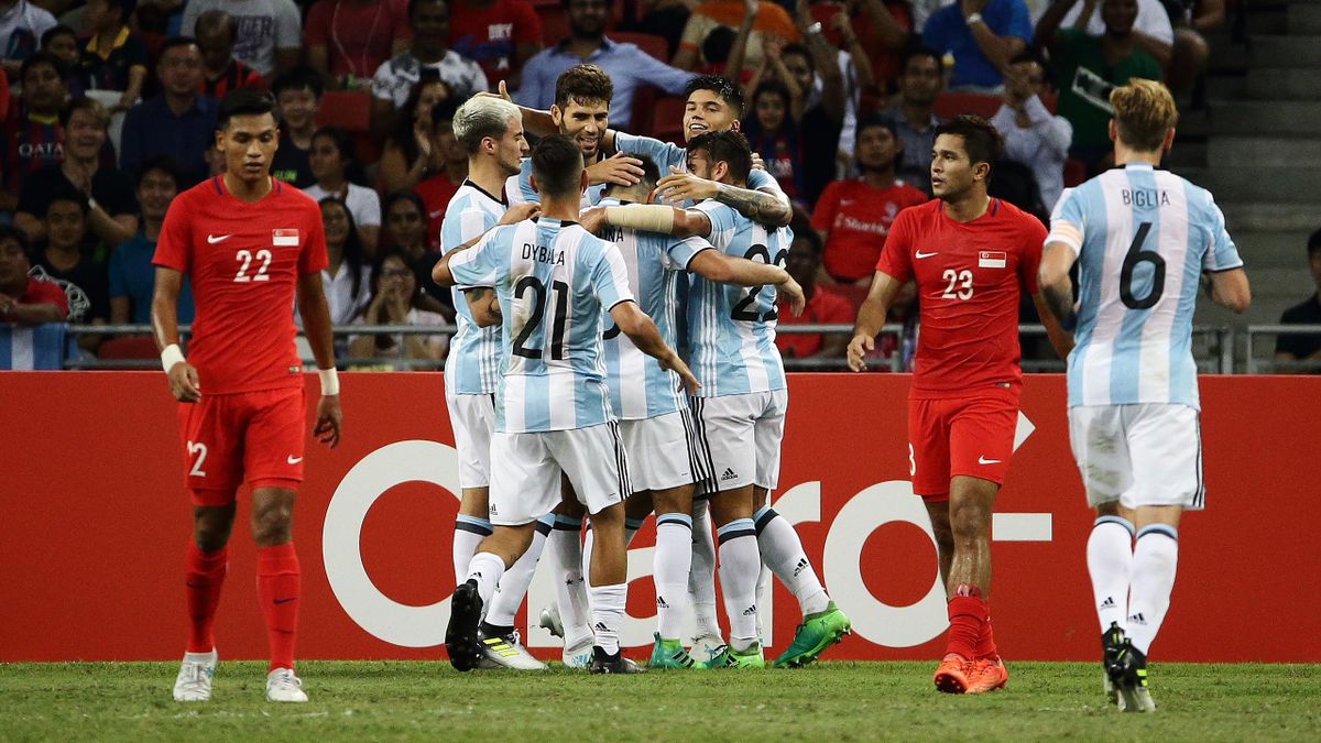 Argentina players celebrate after Federico Fazio of Argentina (C) scores the first goal during the International Test match between Argentina and Singapore at National Stadium on June 13, 2017 in Singapore