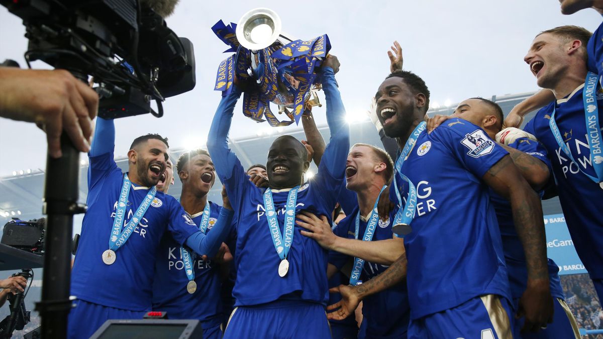 Leicester City's N'Golo Kante lifts the trophy as they celebrate winning the Barclays Premier League