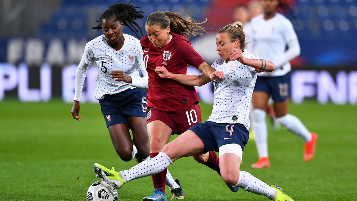 Fran Kirby of England battles for possession with Clara Mateo and Marion Torrent of France during the International Friendly Match between France and England at Stade Michel D'Ornano on April 09, 2021 in Caen, France