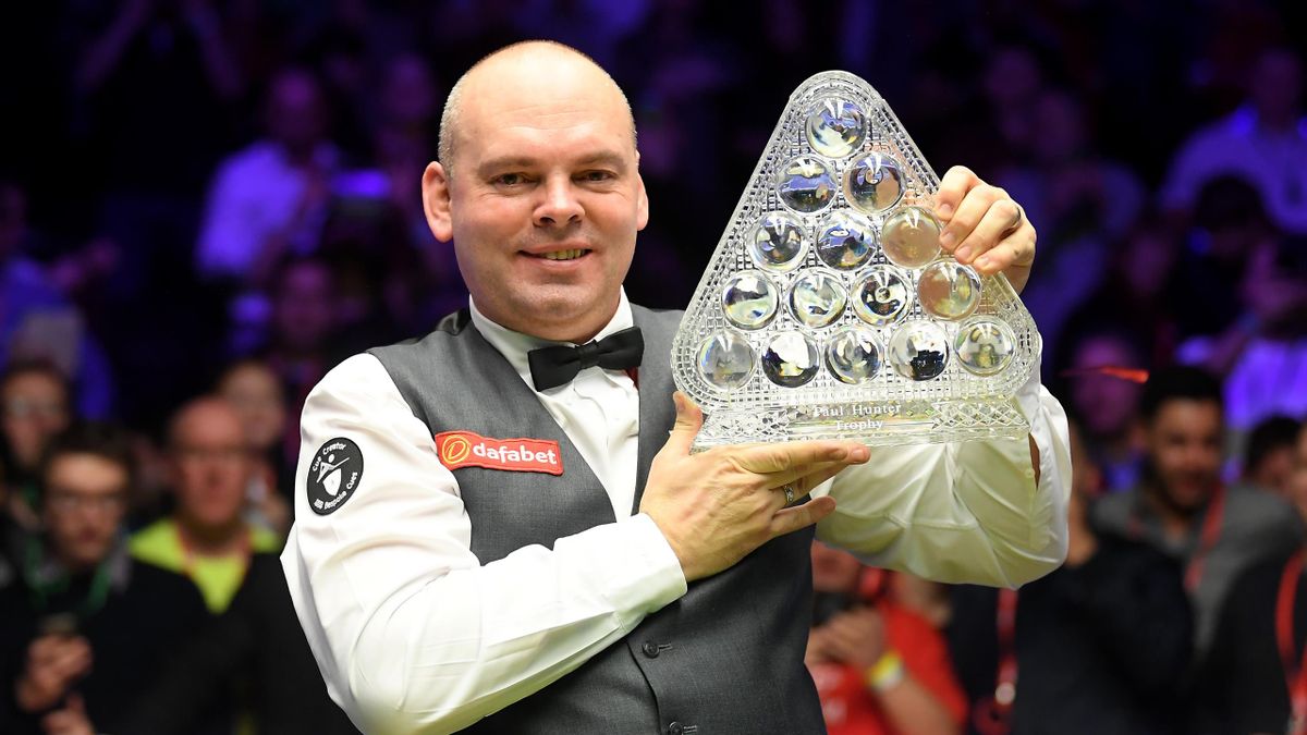 Stuart Bingham poses for a photo with the Paul Hunter Trophy after victory in the Final of the Dafabet Masters between Stuart Bingham and Ali Carter at Alexandra Palace on January 19, 2020 in London, England