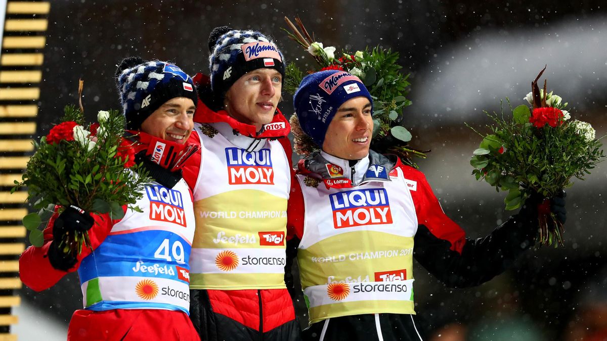 Kamil Stoch of Poland, silver, Dawid Kubacki of Poland, gold and Stefan Kraft of Austria, bronze celebrate their medals in the ski jumping Men's HS109 final round during the 2019 FIS World Ski Championships at Toni Seelos Schanze on March 01