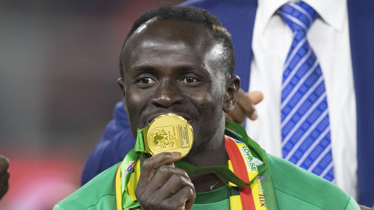 Sadio Mane of Senegal kisses his winners medal after winning the Africa Cup of Nations (CAN) 2021 final match between Senegal and Egypt at Stade d'Olembe in Yaounde on February 6, 2022