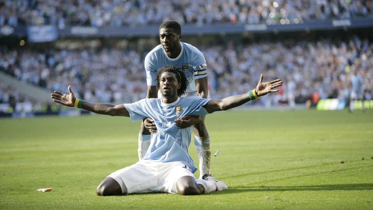 Emmanuel Adebayor of Manchester City celebrates in front of the Arsenal supporters after scoring to make it 3-1