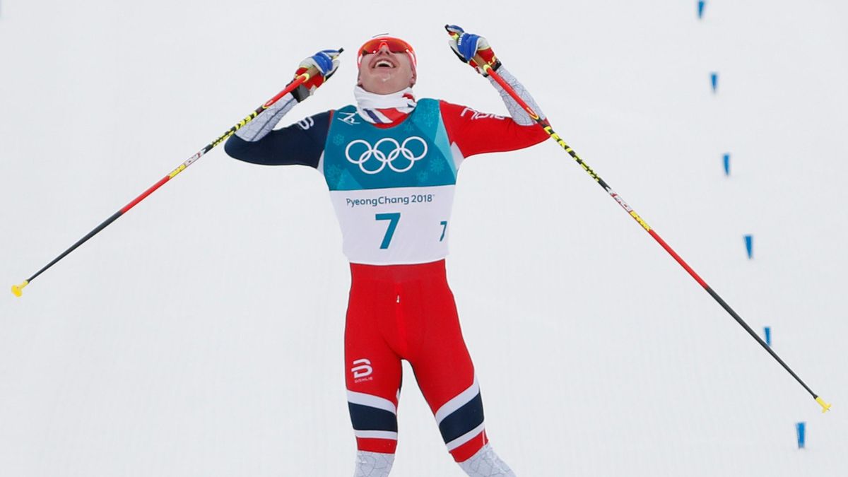 Norway's Simen Hegstad Krueger celebrates winning gold at the end of the men's 15km + 15km cross-country skiathlon at the Alpensia cross country ski centre during the Pyeongchang 2018 Winter Olympic Games on February 11, 2018 in Pyeongchang.