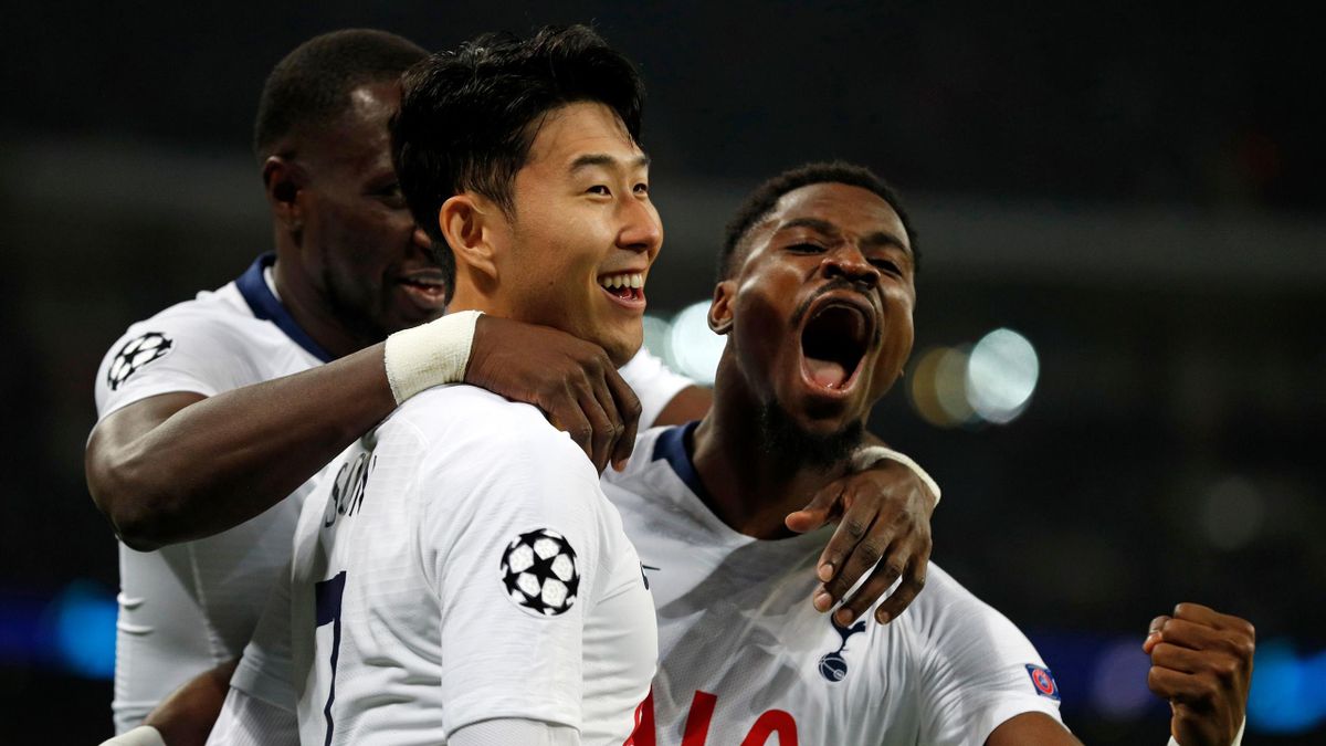 Tottenham Hotspur's South Korean striker Son Heung-Min (C) celebrates with Tottenham Hotspur's Ivorian defender Serge Aurier (R) and Tottenham Hotspur's French midfielder Moussa Sissoko (L) after scoring the opening goal of the UEFA Champions League round