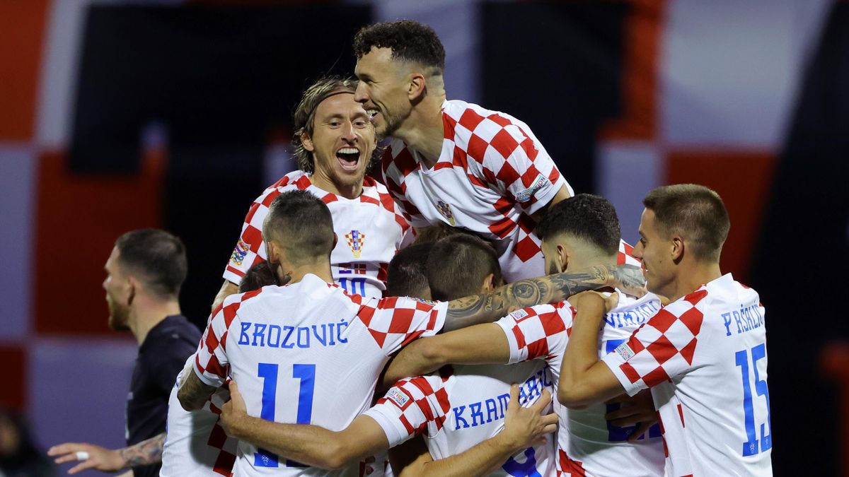 Borna Sosa of Croatia celebrates with Ivan Perisic, Luka Modric and teammates after scoring their side's first goal during the UEFA Nations League League A Group 1 match between Croatia and Denmark at Maksimir Stadium on September 22, 2022 in Zagreb, Croa