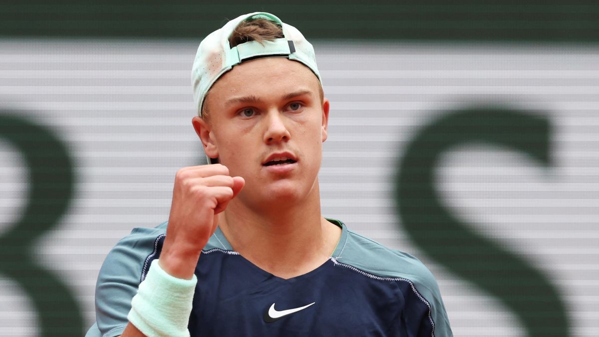 Holger Rune of Denmark celebrates a point against Stefanos Tsitsipas of Greece during the Men's Singles Fourth Round match on Day 9 of The 2022 French Open at Roland Garros on May 30, 2022