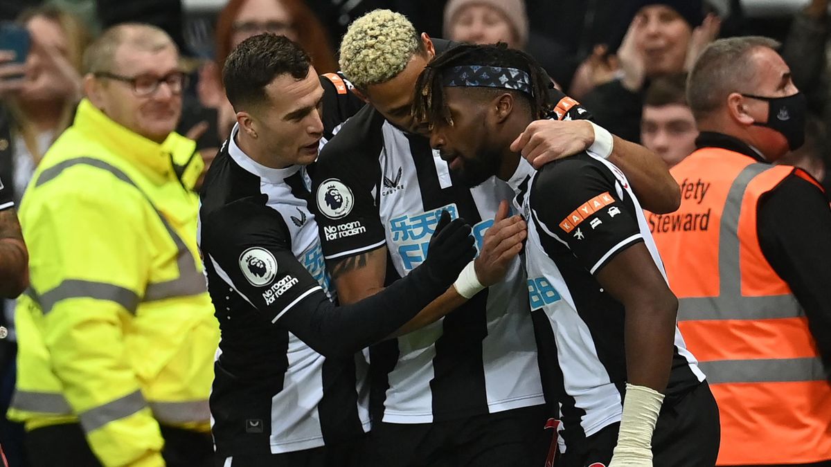 Newcastle United's French midfielder Allan Saint-Maximin (R) celebrates with teammates after scoring the opening goal of the English Premier League football match between Newcastle United and Manchester United at St James' Park in Newcastle-upon-Tyne, nor