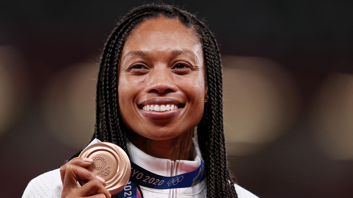 Bronze medallist USA's Allyson Felix celebrates on the podium during the medal ceremony for the women's 400m event during the Tokyo 2020 Olympic Games at the Olympic Stadium in Tokyo on August 6, 2021. (Photo by Ina FASSBENDER / AFP) (Photo by INA FASSBEN