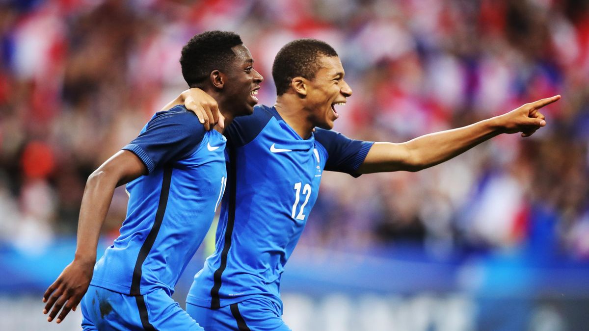 Ousmane Dembele of France celebrates with Kylian Mbappe of France after he scores his team's third goal during the international Friendly match between France and England at Stade de France, on June 13, 2017 in Paris, France.