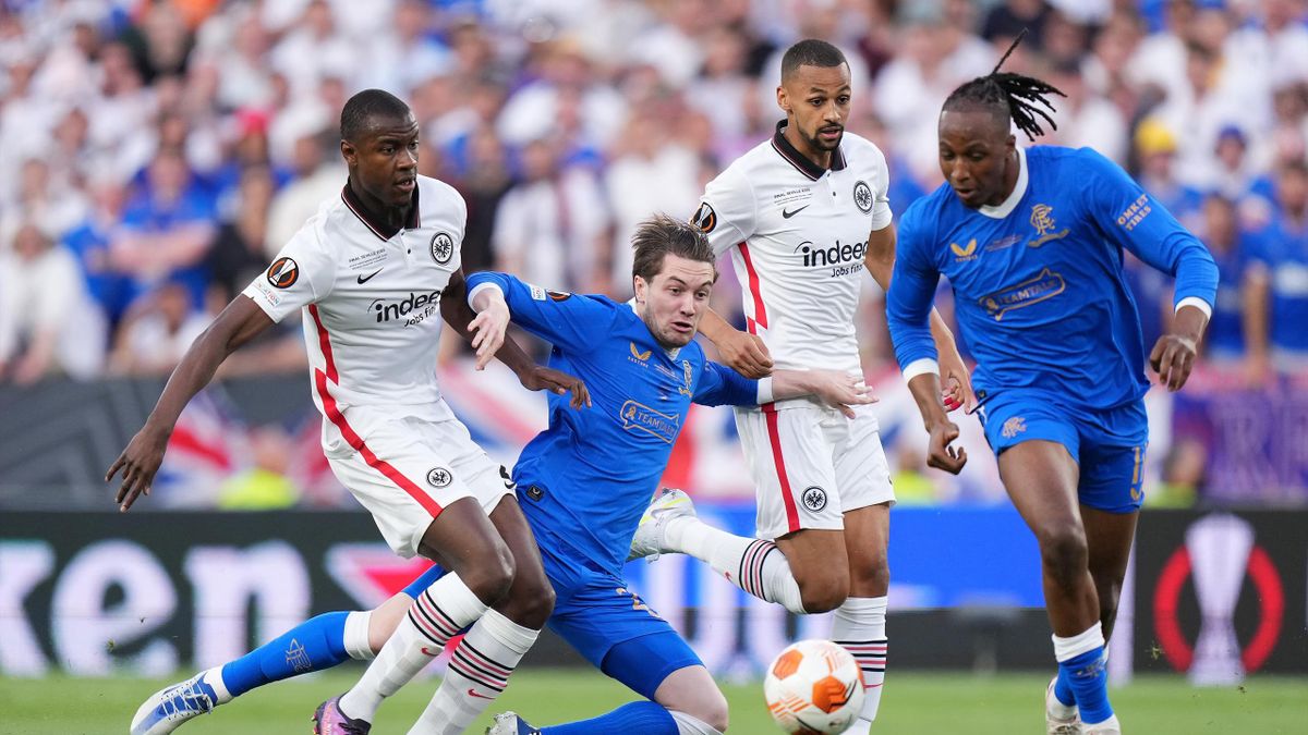 Scott Wright of Rangers is challenged by Evan Ndicka and Djibril Sow of Eintracht Frankfurt during the UEFA Europa League final match between Eintracht Frankfurt and Rangers FC at Estadio Ramon Sanchez Pizjuan on May 18, 2022 in Seville, Spain. (Photo by