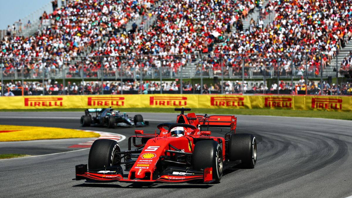 Sebastian Vettel of Germany driving the (5) Scuderia Ferrari SF90 leads Lewis Hamilton of Great Britain driving the (44) Mercedes AMG Petronas F1 Team Mercedes W10 on track during the F1 Grand Prix of Canada at Circuit Gilles Villeneuve on June 09, 2019 i
