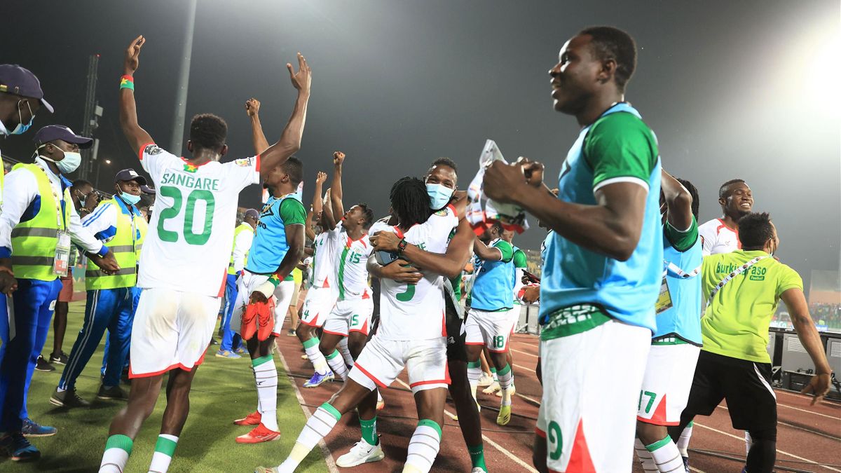 Burkina Faso's players celebrate their victory over Tunisia and their qualification for the semis at the end of the Africa Cup of Nations (CAN) 2021 quarter final football match between Burklina Faso and Tunisia at Stade Roumde Adjia in Garoua on January