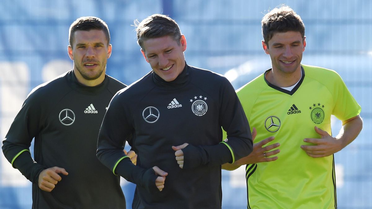 Germany's striker Lukas Podolski, midfielder Bastian Schweinsteiger and midfielder Thomas Mueller