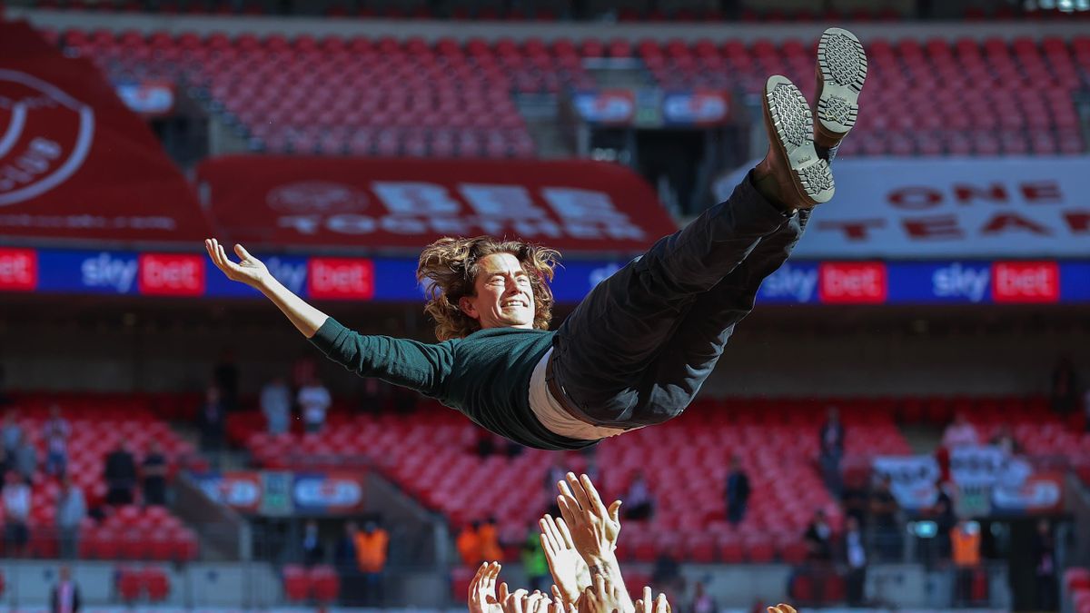 Thomas Frank, Manager of Brentford is thrown in the air after winning the Sky Bet Championship Play-off Final between Brentford FC and Swansea City at Wembley Stadium on May 29, 2021 in London, England.