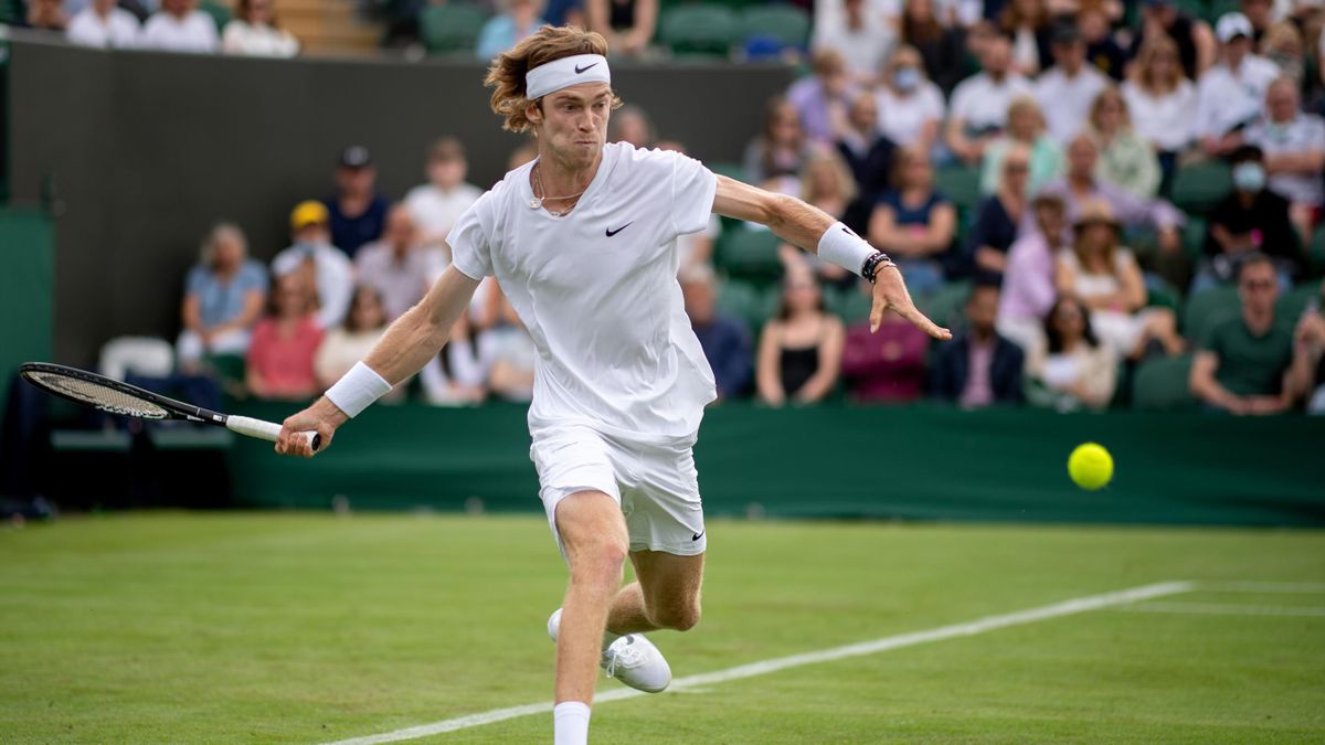Andrey Rublev of Russia plays a forehand in his Men's Singles First Round match against Federico Delbonis of Argentina during Day One of The Championships - Wimbledon 2021 at All England Lawn Tennis and Croquet Club on June 28, 2021 in London, England