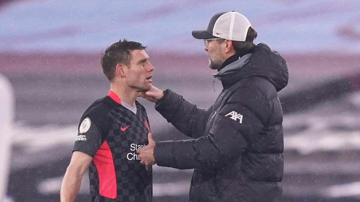 Jurgen Klopp, Manager of Liverpool interacts with James Milner, West Ham United v Liverpool, Premier League, London Stadium, January 31, 2021
