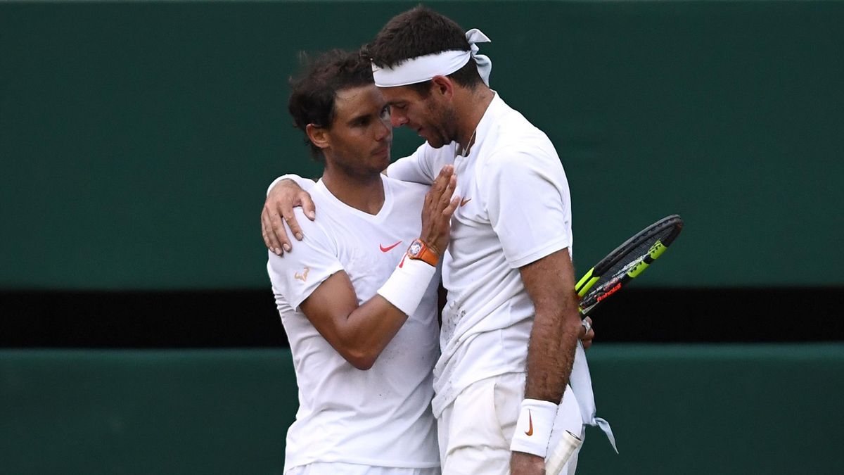 Rafael Nadal of Spain and Juan Martin Del Potro of Argentina embrace following their Men's Singles Quarter-Finals match on day nine of the Wimbledon Lawn Tennis Championships at All England Lawn Tennis and Croquet Club on July 11, 2018 (Getty Images)