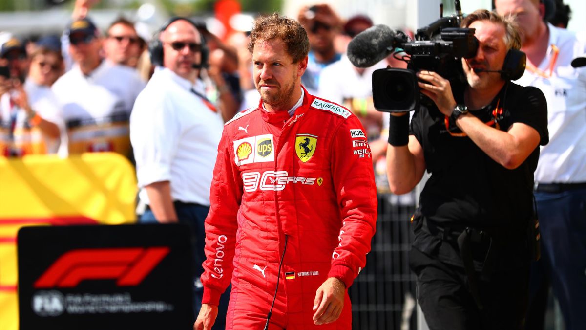 Sebastian Vettel of Germany and Ferrari walks in to parc ferme to swap the 1st and 2nd place boards after the F1 Grand Prix of Canada at Circuit Gilles Villeneuve on June 9, 2019 in Montreal, Canada.