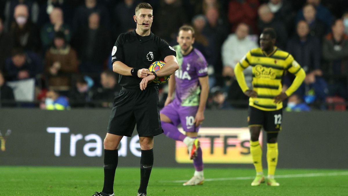 Robert Jones, Match Referee gestures towards his watch during the Premier League match between Watford and Tottenham Hotspur at Vicarage Road on January 01, 2022 in Watford, England. (Photo by Richard Heathcote/Getty Images)