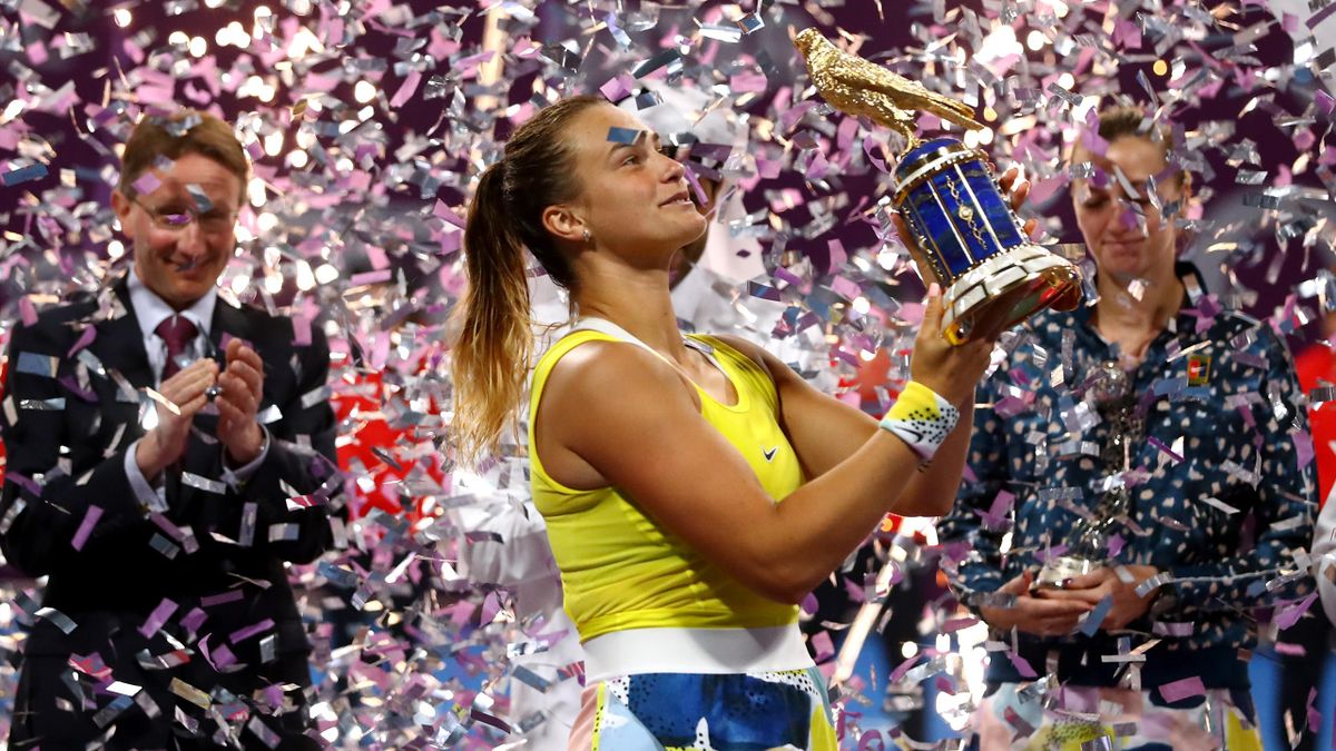 Aryna Sabalenka of Belarus celebrates with the trophy after victory against Petra Kvitova of Czech Republic in the Singles Final match on Day 7 of the WTA Qatar Total Open 2020 at Khalifa International Tennis and Squash Complex on February 29, 2020 in Doh