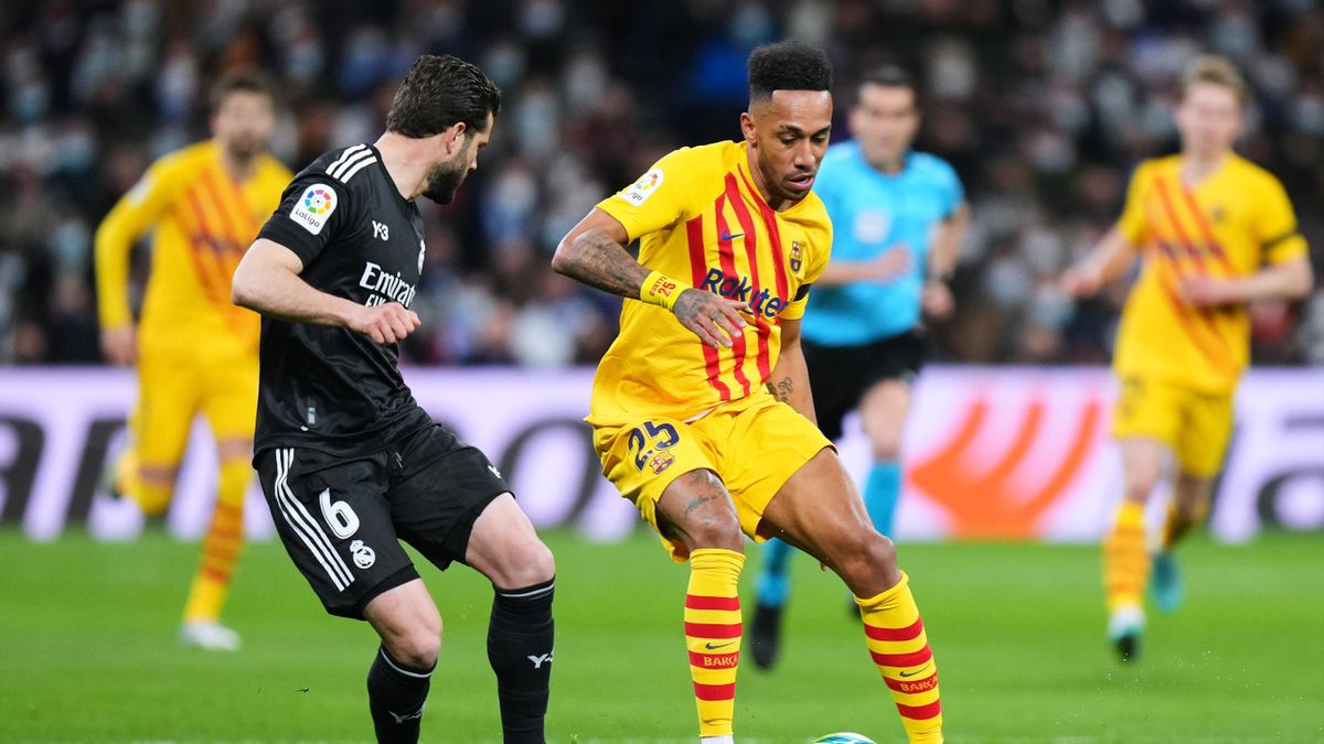 Nacho Fernandez of Real Madrid duels for the ball with Pierre-Emerick Aubameyang of FC Barcelona during the LaLiga Santander match between Real Madrid CF and FC Barcelona at Estadio Santiago Bernabeu on March 20, 2022 in Madrid, Spain