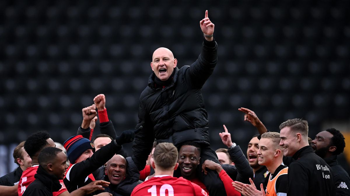 Mark Stimson, Manager of Hornchurch is held aloft by his players after winning in a penalty shootout during the FA Trophy semi-final between Notts County and Hornchurch at Meadow Lane on March 27, 2021