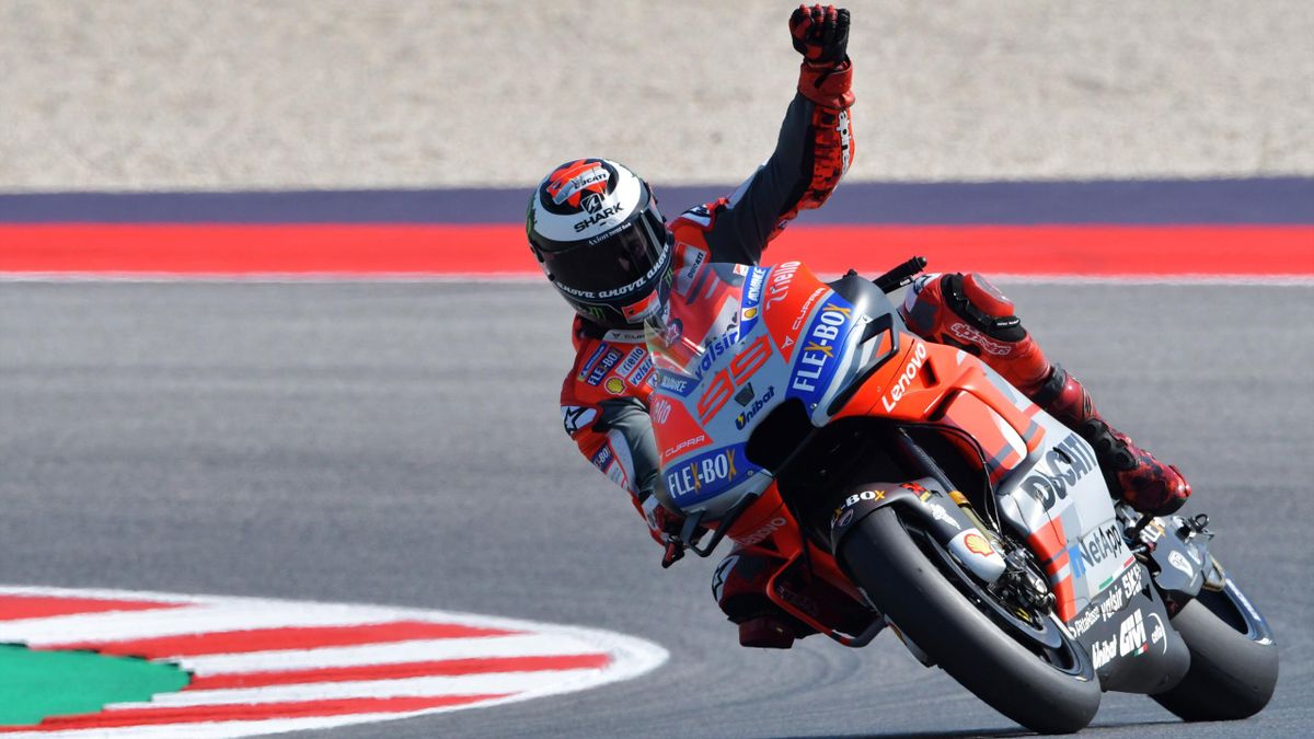 Ducati Team's Spanish rider Jorge Lorenzo celebrates winning the pole position during the qualifying session of the San Marino MotoGP Grand Prix race at the Marco Simoncelli Circuit in Misano on September 8, 2018.