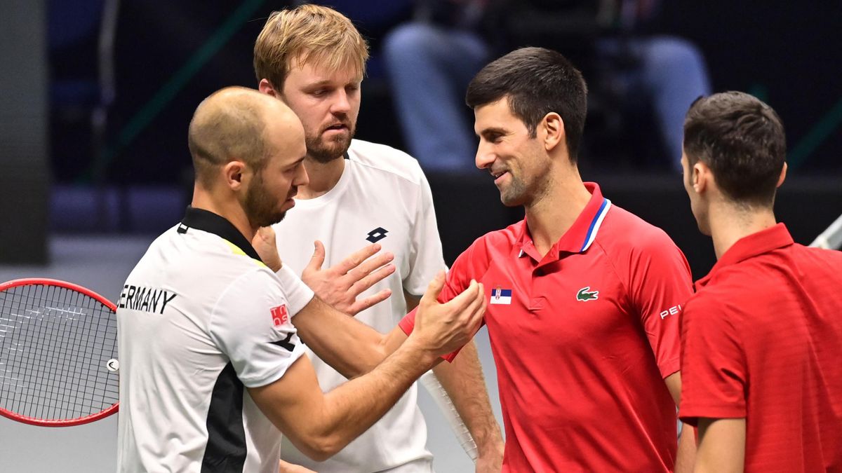 Germany's Kevin Krawietz (2ndL) and Tim Puetz (L) are congratulated by Serbia's Novak Djokovic (2ndR) and Nikola Cacic (R) at the end of the men's doubles group stage match between Serbia and Germany of the Davis Cup tennis tournament in Innsbruck, on Nov