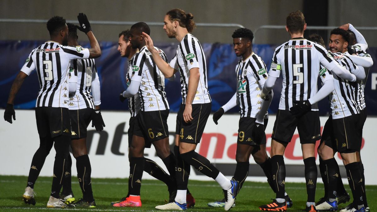 Angers' French midfielder Angelo Fulgini (R) is congratulated after scoring during the French Cup round-of-64 football match between Angers SCO and Stade Rennais Football Club, on February 11, 2021, at Raymond-Kopa Stadium, in Angers, western France.