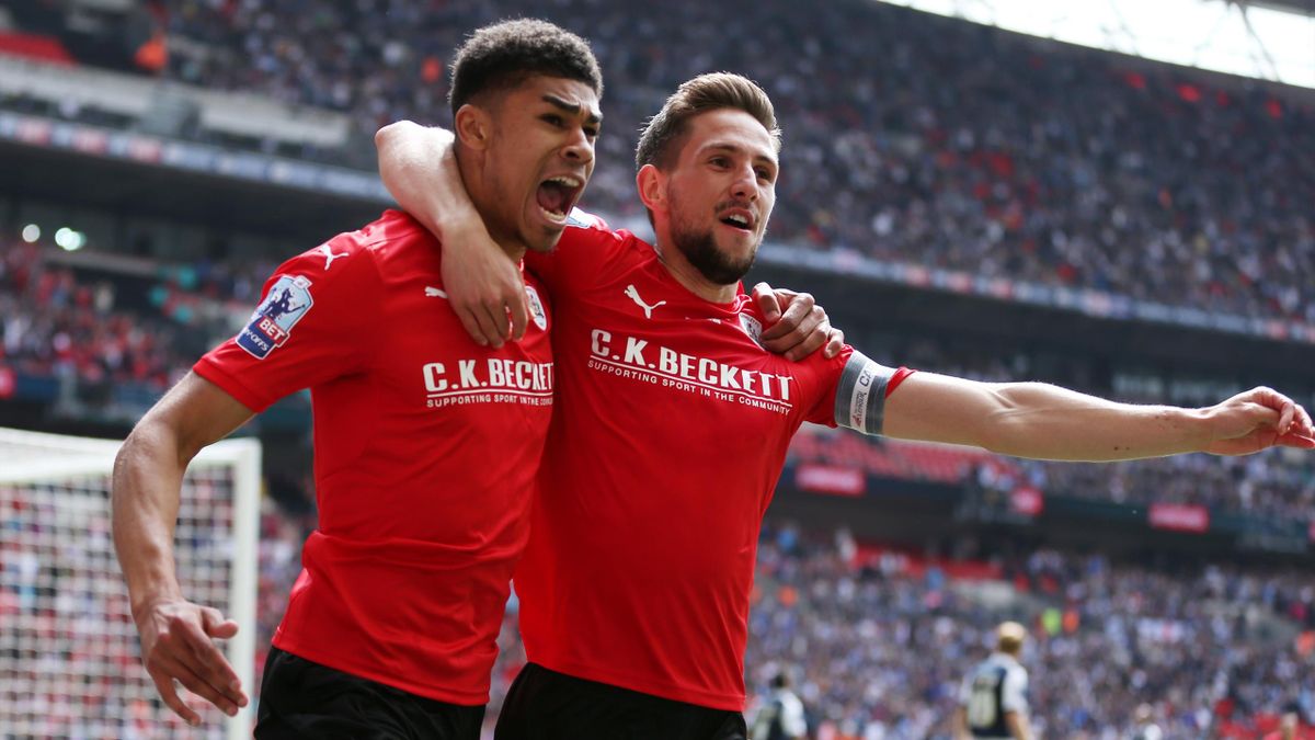 Ashley Fletcher celebrates after scoring the first goal for Barnsley