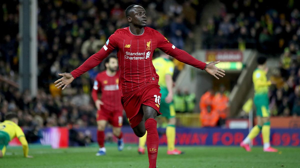 Sadio Mane of Liverpool celebrates scoring the opening goal during the Premier League match between Norwich City and Liverpool FC at Carrow Road on February 15, 2020 in Norwich, United Kingdom.