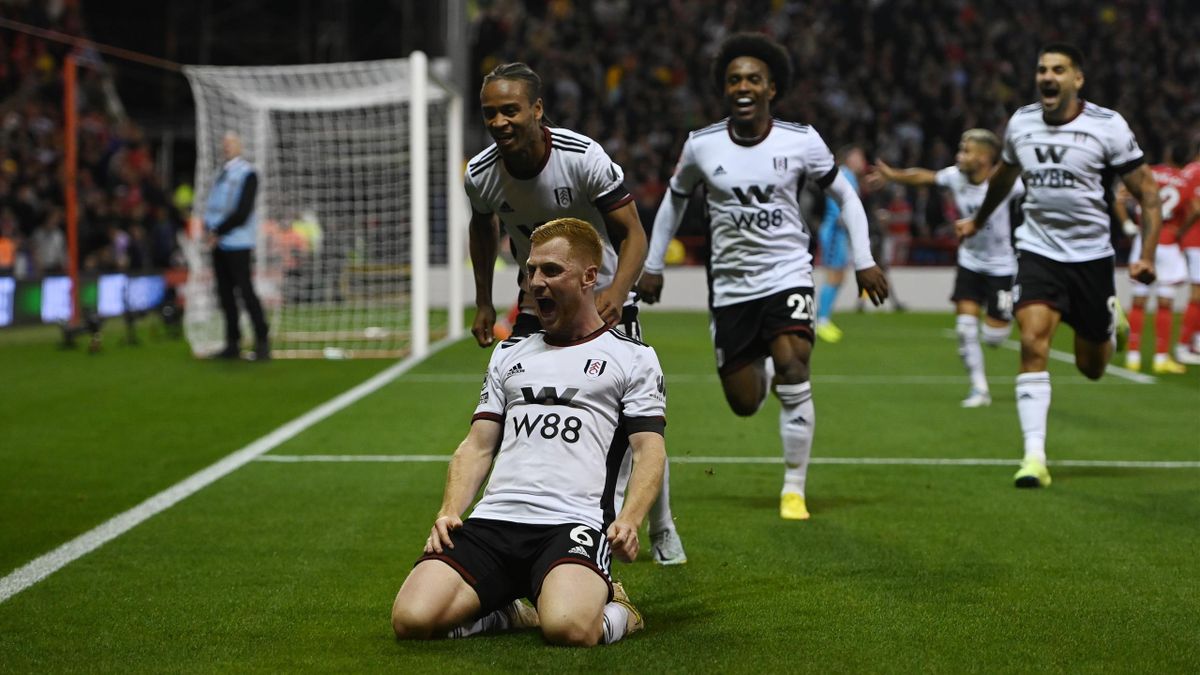 Harrison Reed of Fulham celebrates with teammates Bobby Reid and Willian after scoring their team's third goal during the Premier League match between Nottingham Forest and Fulham FC at City Ground on September 16, 2022 in Nottingham, England.