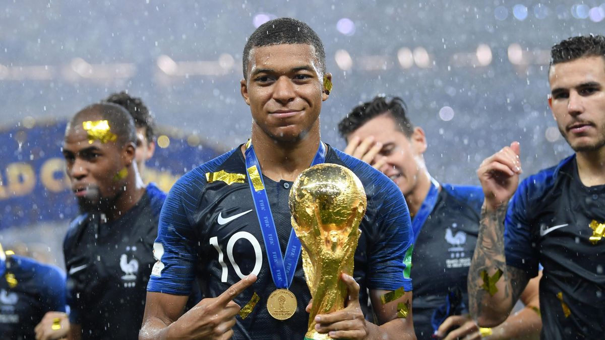 Kylian Mbappe of France celebrates with the World Cup trophy