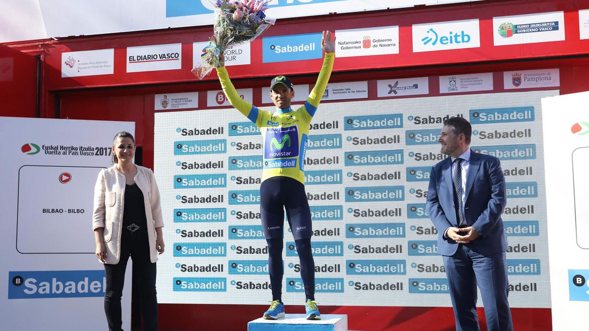 Movistar's Spanish rider Alejandro Valverde celebrates on the podium, sporting the overall leader jersey, after winning the fifth stage of the 2017 Tour of the Basque country