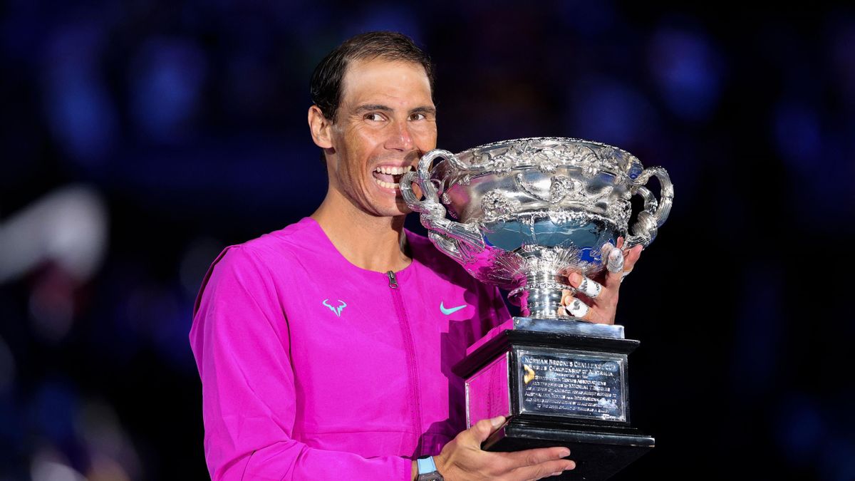 Spain's Rafael Nadal celebrates with the Norman Brookes Challenge Cup trophy following his victory against Russia's Daniil Medvedev in their men's singles final match on day fourteen of the Australian Open tennis tournament in Melbourne