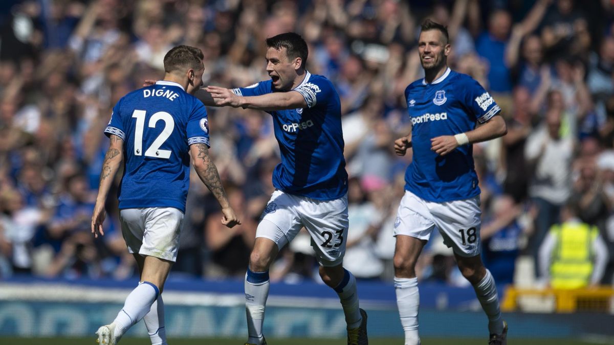 Lucas Digne of Everton is congratulated by team mates Seamus Coleman and Morgan Schneiderlin after scoring the third goal during the Premier League match between Everton FC and Manchester United at Goodison Park on April 21, 2019 in Liverpool, United King