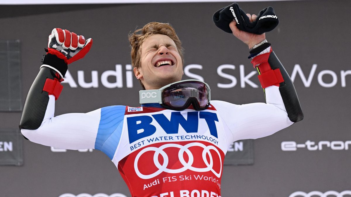 Switzerland's Marco Odermatt reacts during the podium ceremony after winning the Men's Giant Slalom race during the FIS Alpine ski World Cup on January 8, 2022, in Adelboden. (Photo by Sebastien Bozon / AFP) (Photo by SEBASTIEN BOZON/AFP via Getty Images)